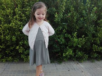 Cute girl standing outdoors