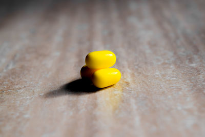 Close-up of yellow leaf on table