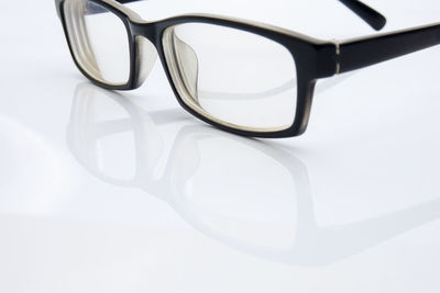 High angle view of eyeglasses on gray background