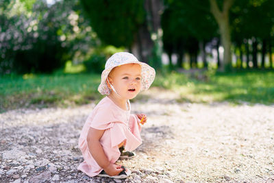 Cute baby girl on land