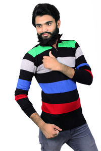 Portrait of young man standing against white background