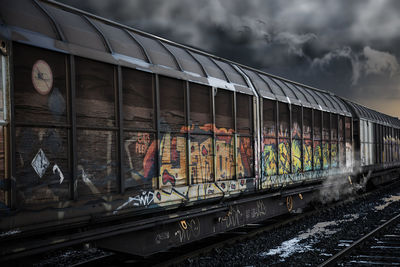 Train on railroad track against sky