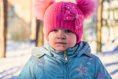 Close-up portrait of cute girl wearing warm clothing during winter