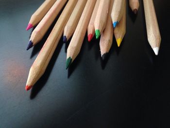 Close-up of multi colored pencils on table