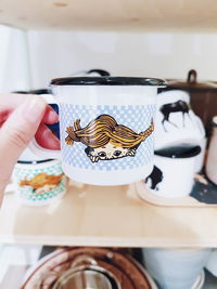 Close-up of hand holding ice cream