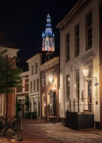 Illuminated buildings in city at night