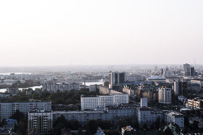 High angle view of buildings in city against clear sky