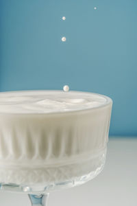 Close-up of dentures against blue background