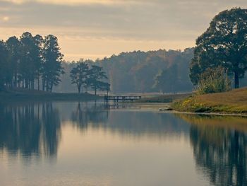 Scenic view of lake against sky during sunset