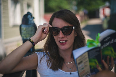Portrait of young woman using mobile phone