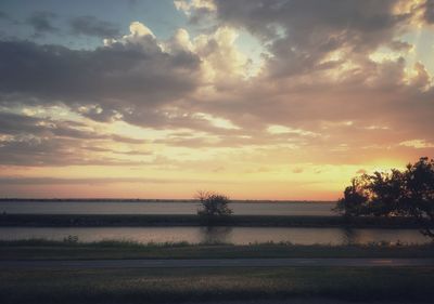 Scenic view of lake against sky during sunset