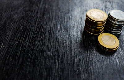 High angle view of coins on table