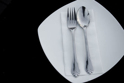 Close-up of ice cream on table against black background