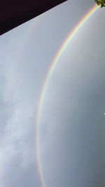 Low angle view of rainbow against sky