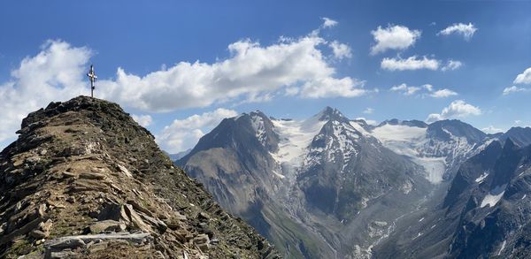 Panoramic view of snowcapped mountains against sky