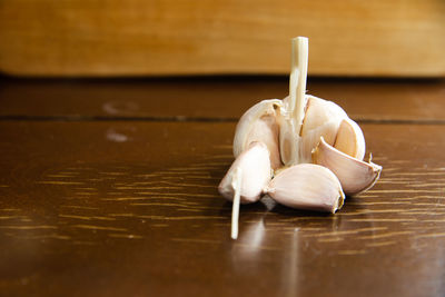 Close-up of white garlic on table