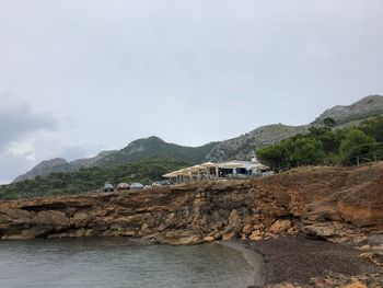 Scenic view of rocks and mountains against sky