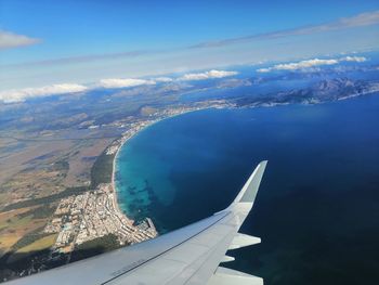 Aerial view of airplane flying in sky