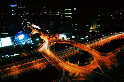 High angle view of light trails on road at night