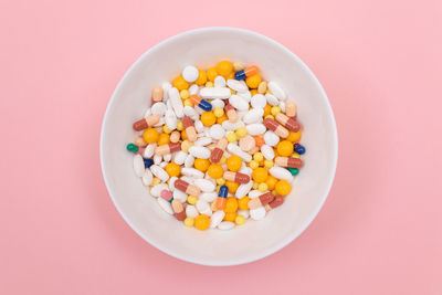 High angle view of multi colored candies in container