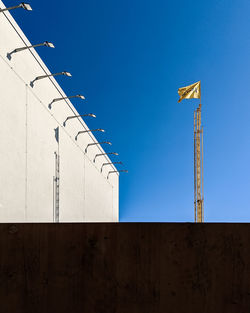 Low angle view of building against clear blue sky