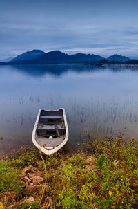 Boats moored in lake