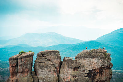 Panoramic view of rocks and mountains against sky