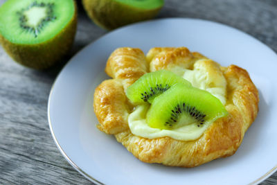 Close-up of fruits served in plate on table
