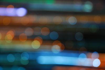 Defocused image of colorful illuminated lights at night