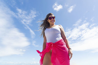 A woman on top of a boat against the sea in the background. salvador, bahia, brazil.