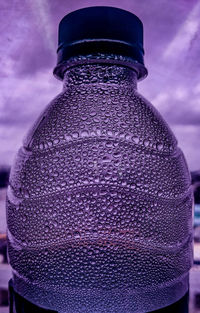 Low angle view of bottle against sky