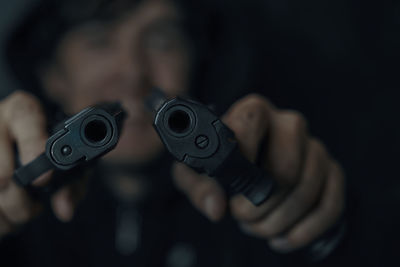 Close-up of hand holding camera