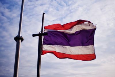 Low angle view of flag against sky