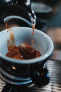 Close-up of coffee cup on table