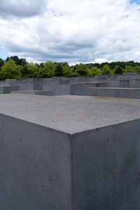 View of concrete structure against cloudy sky