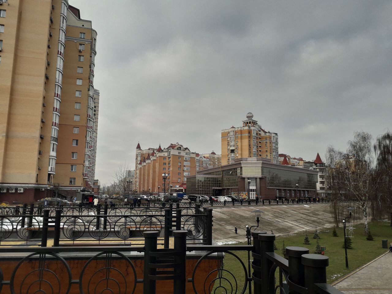 BUILDINGS AGAINST CLOUDY SKY