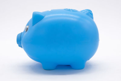 Close-up of blue toy over white background