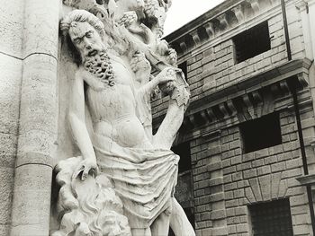 Low angle view of statue against sky