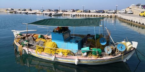 High angle view of fishing boats moored at harbor