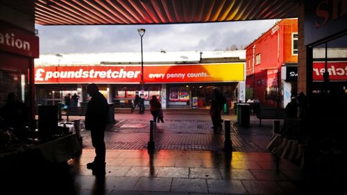 People walking on street in city