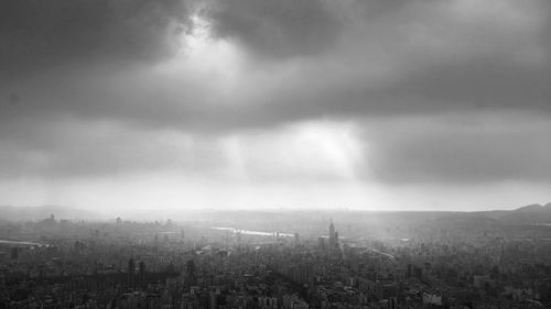 Aerial view of cityscape against sky