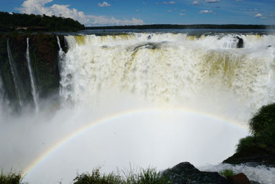 Scenic view of rainbow over sea