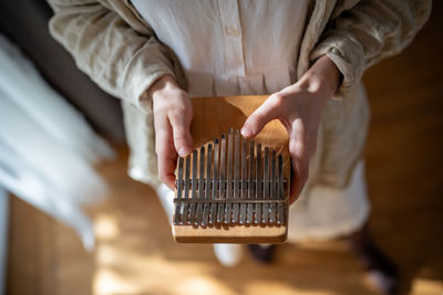 Cropped image of man holding key