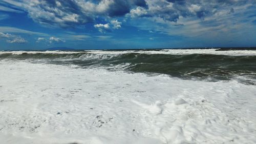 Scenic view of beach against sky