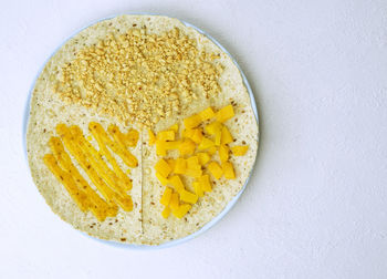 High angle view of food in bowl against white background