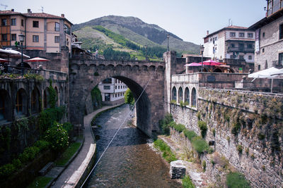 Bridge over buildings in city