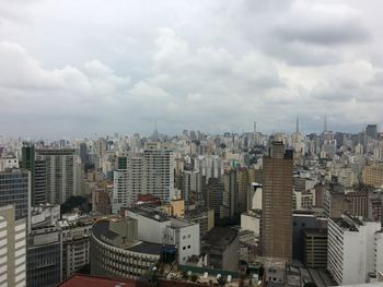 High angle view of buildings in city against sky