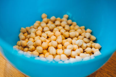 High angle view of chick-peas in blue bowl