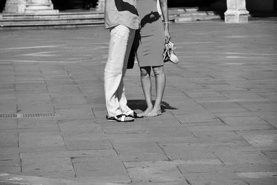 Low section of people walking on footpath