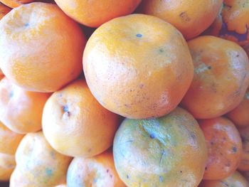 Full frame shot of oranges at market stall